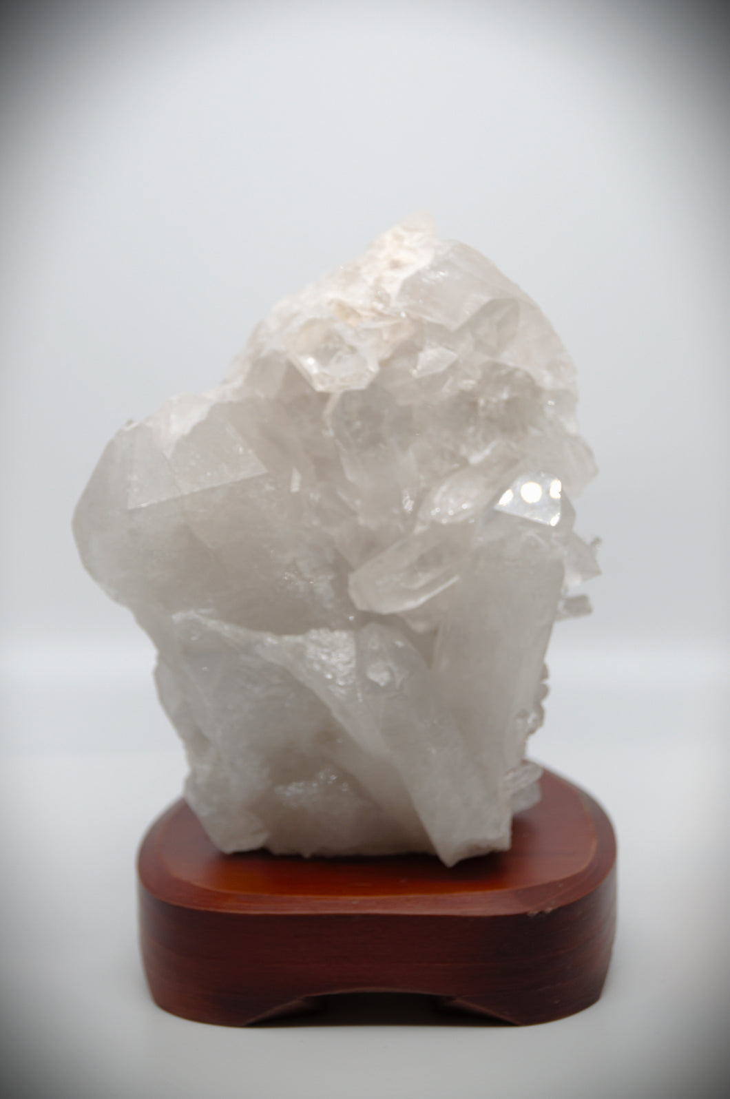 Clear Quartz Crystal Stone (with polished wooden base)
